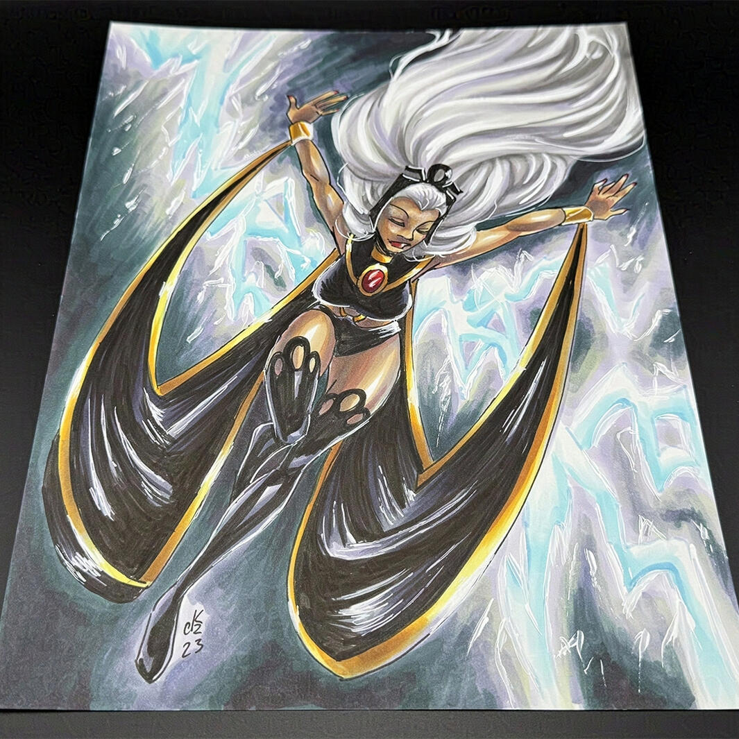 A pinup of Storm on 8.5x11" paper, ink and copic marker on cardstock.