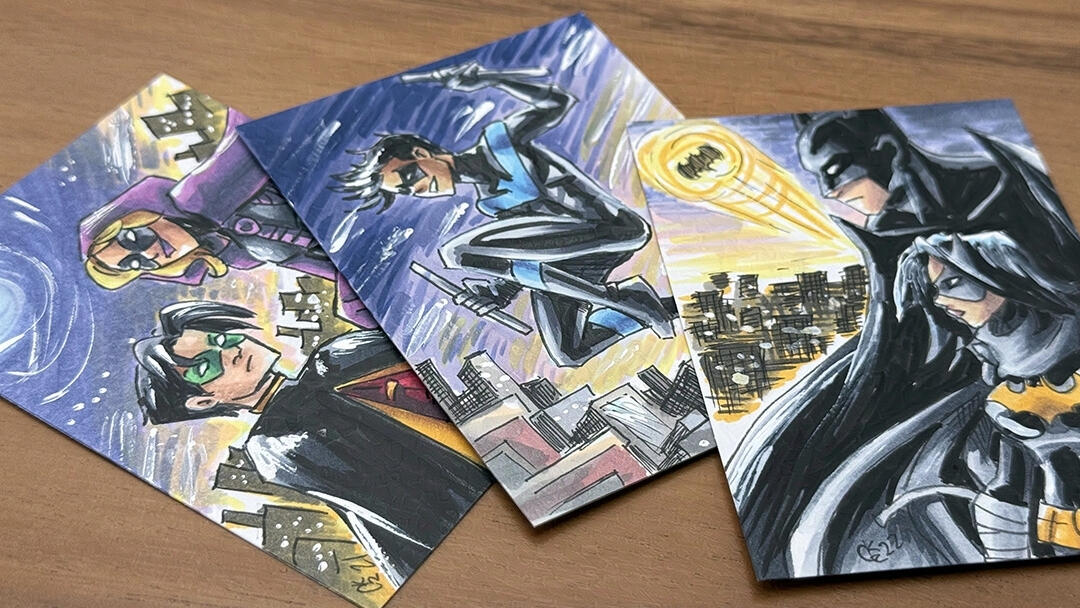 A spray of sketch cards featuring Nightwing, Robin with Spoiler, and Batman with Black Bat.